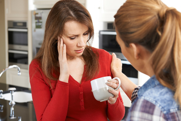 Sad Woman Being Consoled At Home By Female Friend - Photo, image