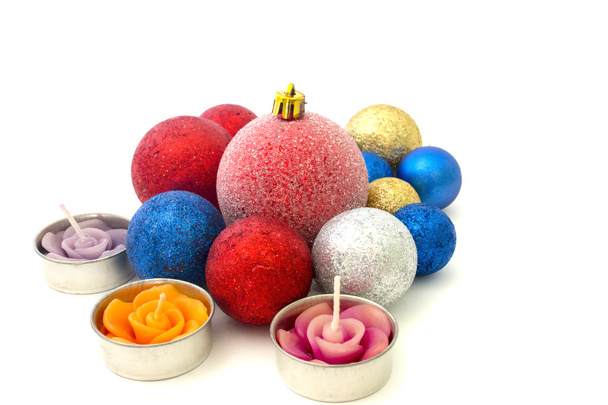 Christmas toys and candles on a white background - Zdjęcie, obraz