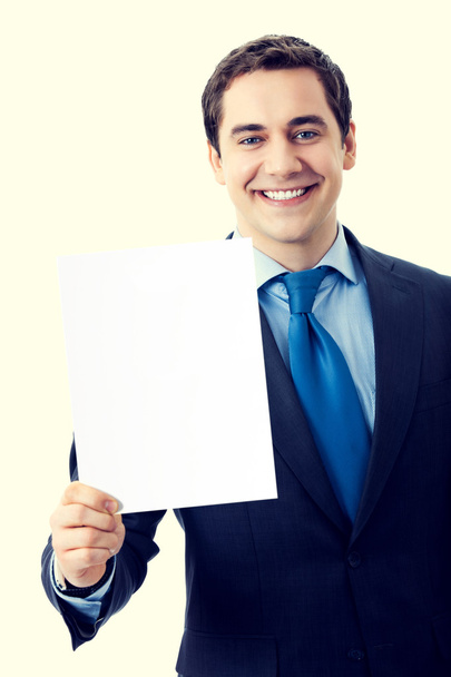 Happy smiling businessman showing blank signboard - Fotó, kép