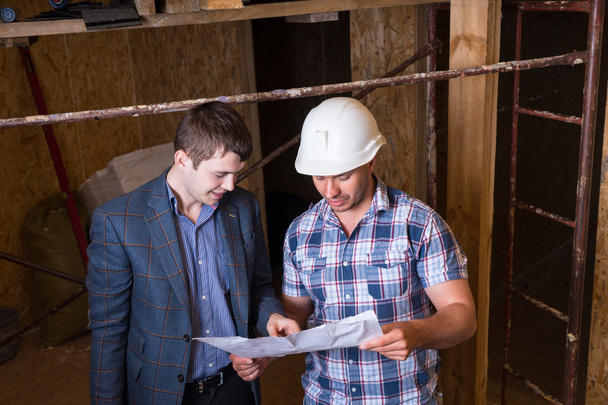 Architect and Foreman Inspecting Building Plans - Photo, Image