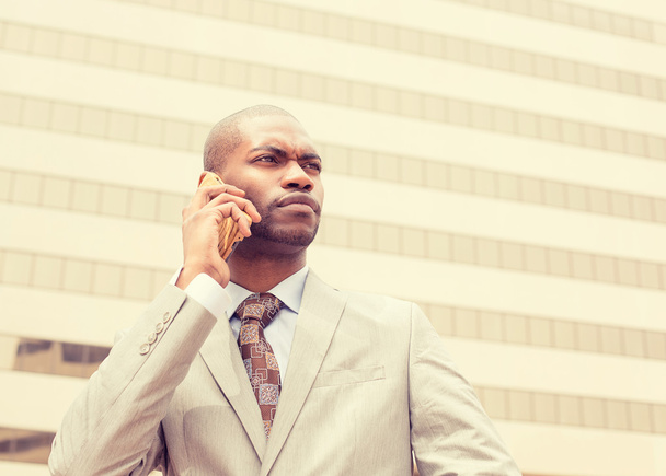 handsome young businessman talking on mobile phone  - 写真・画像