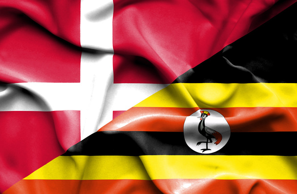 Waving flag of Uganda and Denmark  - Фото, изображение