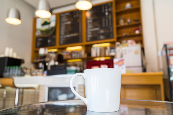 Coffee cup on table in cafe - Zdjęcie, obraz