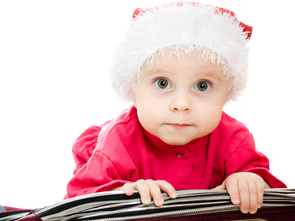 Christmas baby in the suitcase on a white background. - Fotoğraf, Görsel