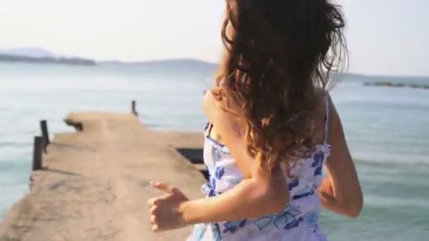 Beautiful Woman Running on Beach Pier - Materiał filmowy, wideo