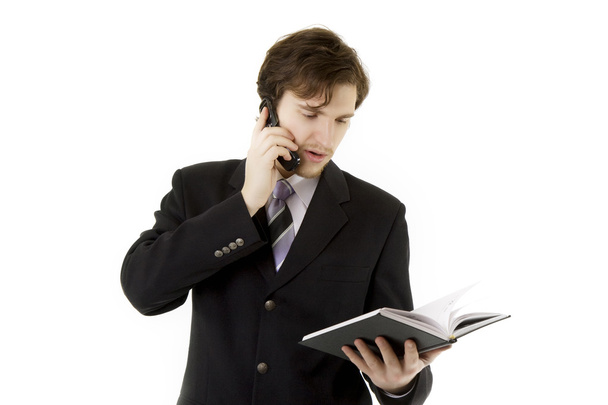 Businessman with phone and daily - Zdjęcie, obraz