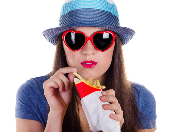 woman eating fries potatoes  - Foto, Imagen