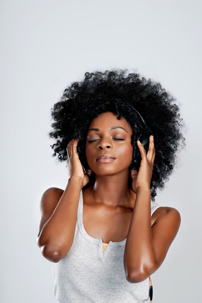 woman with afro listening to music - Photo, Image