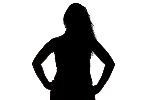 Silhouette of woman with hands on hips - Photo, Image