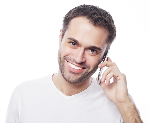  man in shirt speaking on the phone - Foto, afbeelding
