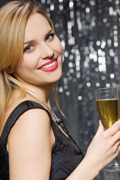 Woman with glass of champagne - Фото, зображення
