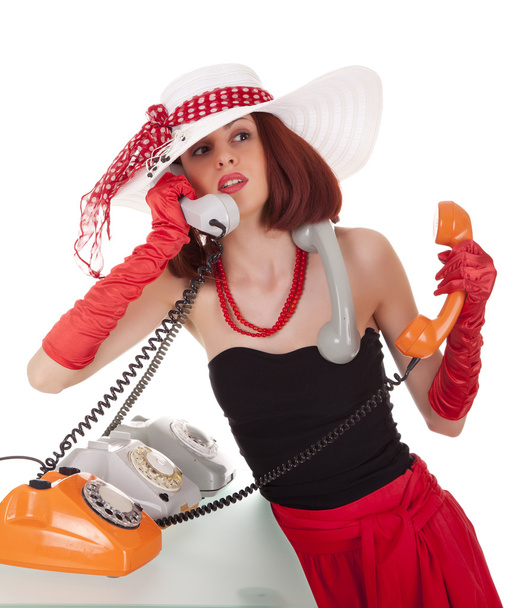 Fashion girl in retro style with vintage phones - Foto, afbeelding