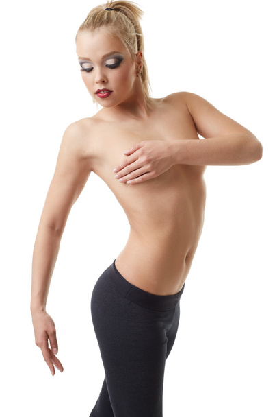 Erotic sport. Pretty female athlete posing topless - Foto, Bild