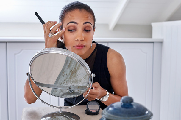 professional business woman applying makeup - Fotó, kép
