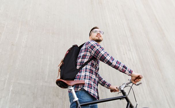 hipster man with fixed gear bike and backpack - Fotó, kép