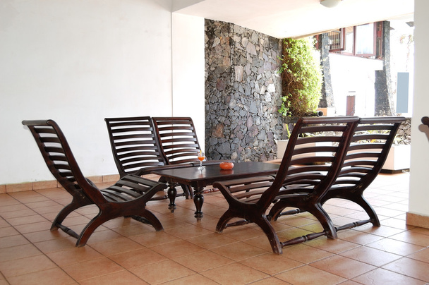 Table, chairs and glass of juice at popular hotel, Bentota, Sri - Фото, зображення
