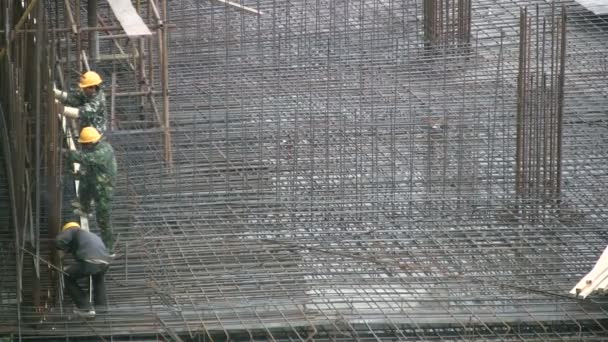 Trabajadores chinos en una obra de construcción
 - Metraje, vídeo