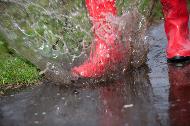 Jump into a big puddle after rain - Fotoğraf, Görsel