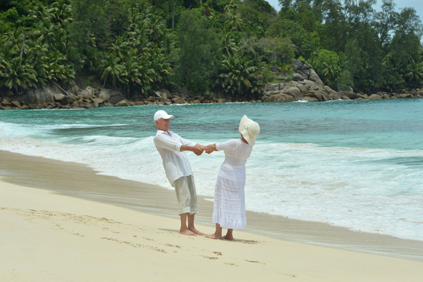 elderly couple rest at tropical resort - Photo, Image