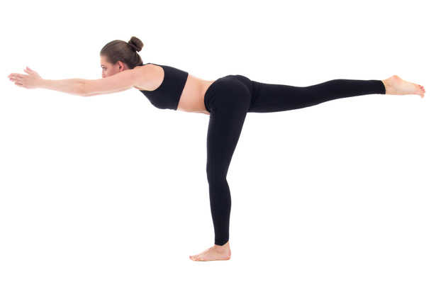 balance concept - young woman standing in yoga pose isolated on  - Φωτογραφία, εικόνα