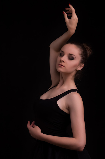 Silhouette ballet dancer in black swimsuit at the studio  - Photo, Image