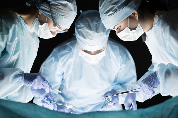 Medical team performing operation - Photo, Image