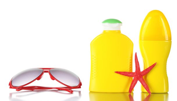 Bottles of suntan cream with sunglasses and sea star isolated on white - Φωτογραφία, εικόνα