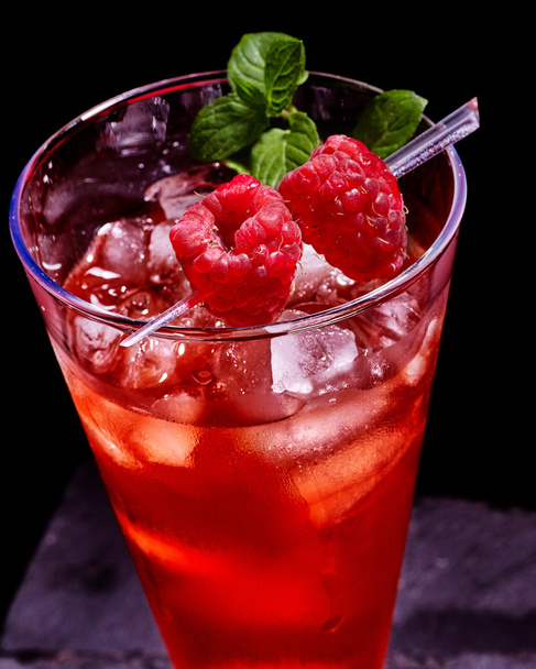 Red cocktail on dark background. - Photo, Image