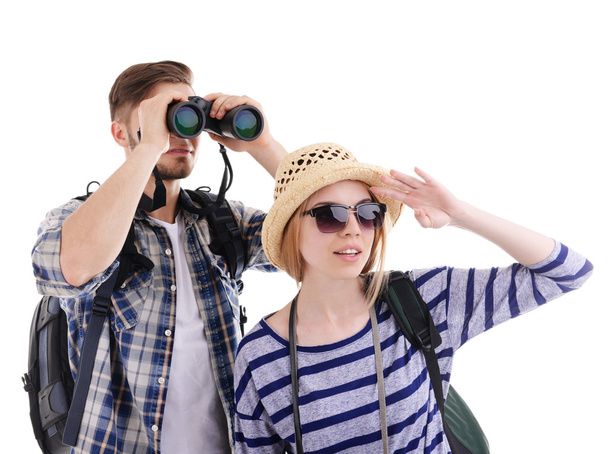 Pair of travelers with binoculars isolated on white - Foto, afbeelding