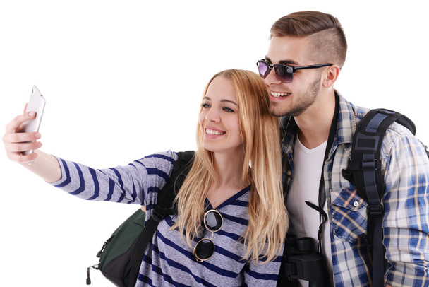Pair of travelers making photo with phone camera isolated on white - Fotoğraf, Görsel
