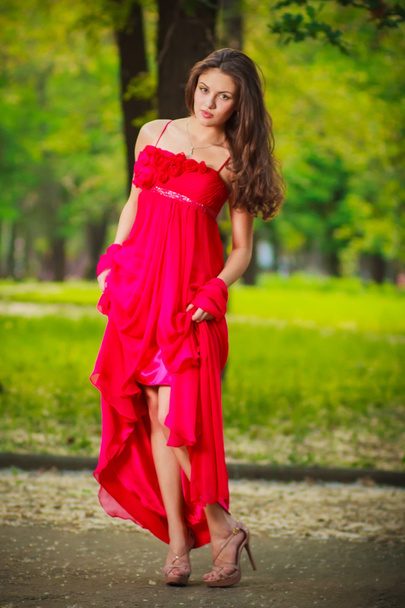 woman in red walking - Photo, Image
