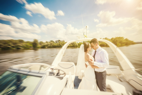 Bride and groom on a yacht - Φωτογραφία, εικόνα