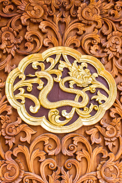 snack wood Carving Wall sculptures in thai temple - Photo, Image