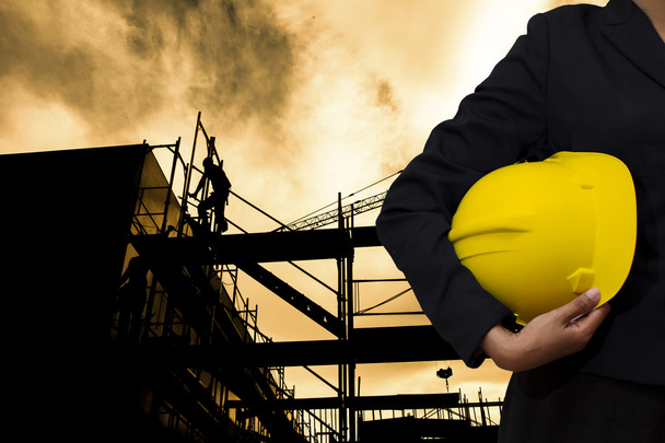 engineer holding Yellow helmet - Photo, Image