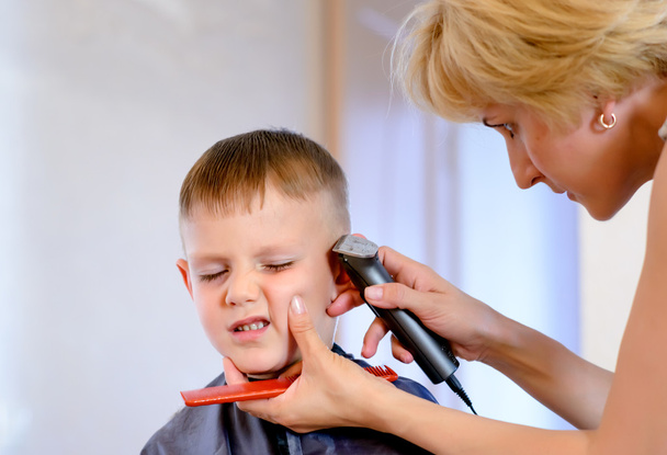 Little boy unimpressed with his haircut - Photo, Image