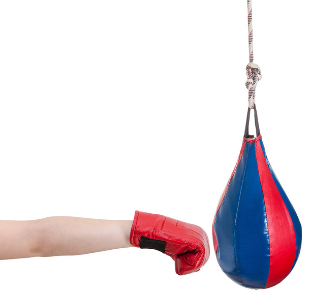 kid with boxing glove punches punching bag - Fotoğraf, Görsel