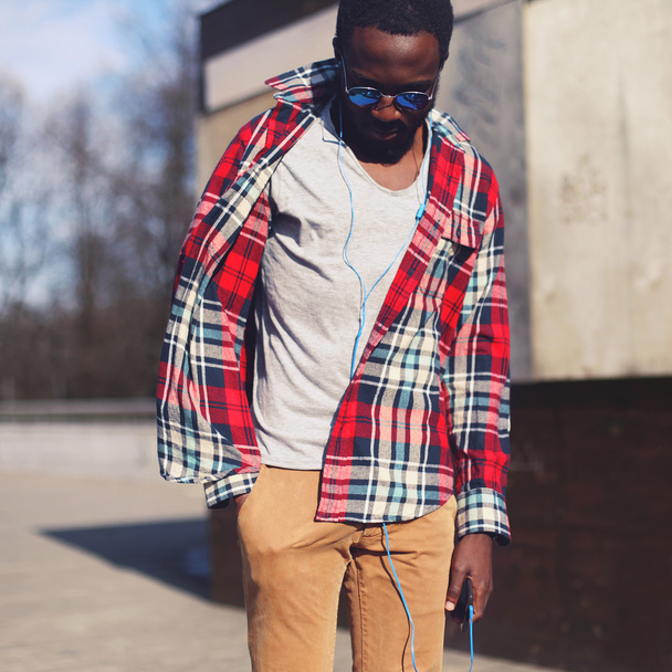 Street fashion concept - portrait of stylish young african man s - 写真・画像