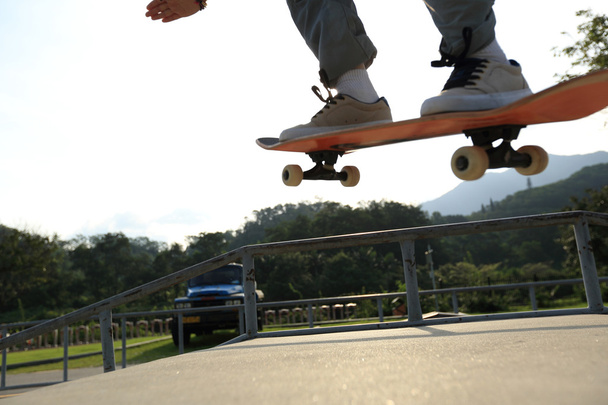 Skateboarder legs doing ollie - Fotó, kép