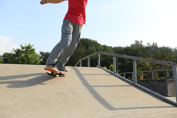Skateboarder legs on  skateboard - Foto, Imagen
