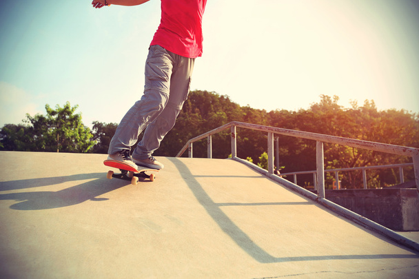 Skateboarder legs on  skateboard - Fotoğraf, Görsel