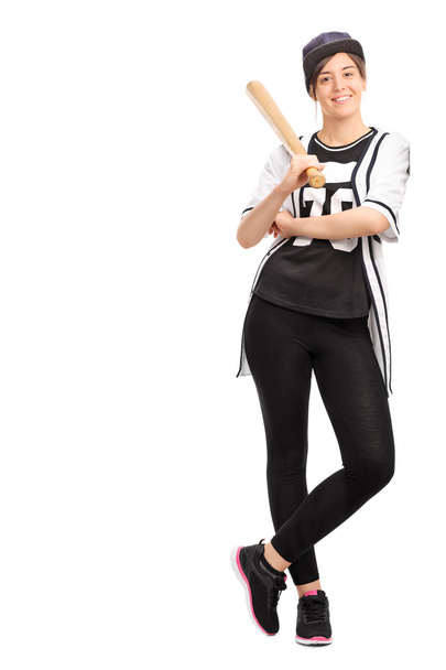 woman in a baseball jersey holding a bat - Zdjęcie, obraz