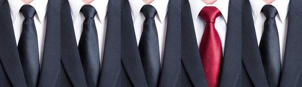 Red tie between black neckties - Photo, Image