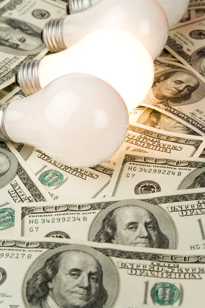 Bright Light Bulb and Dollar - Photo, image