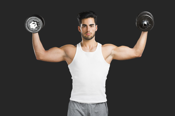 Athletic man lifting weights - Fotoğraf, Görsel