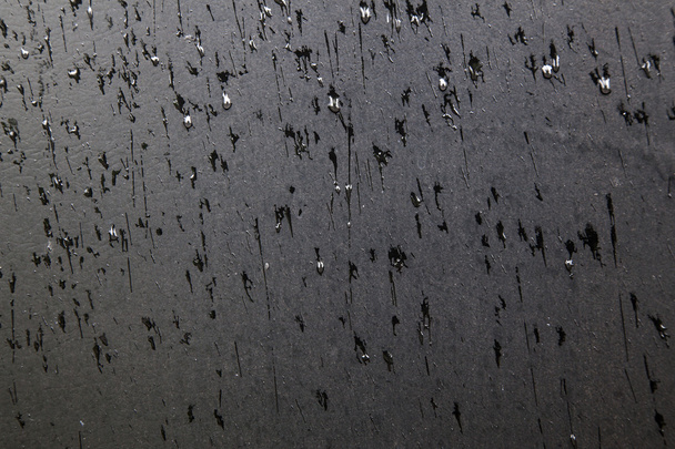 modello di gocce di pioggia sulla superficie nera
 - Foto, immagini