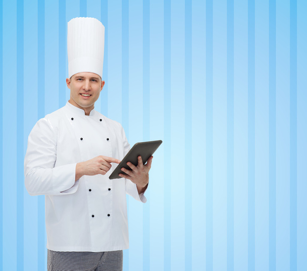 happy male chef cook holding tablet pc - Foto, imagen