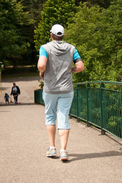 running man on a bridge - Foto, afbeelding