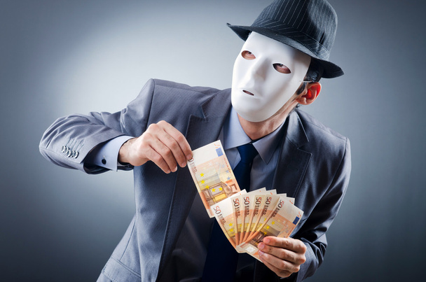Empresario con dinero y máscara
 - Foto, imagen