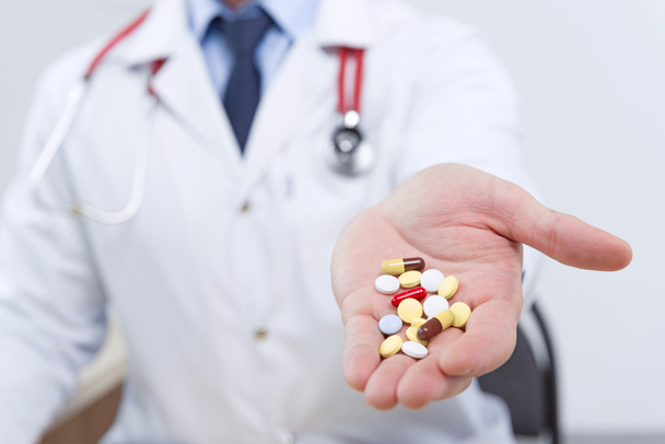 Professional doctor giving pills - Photo, Image
