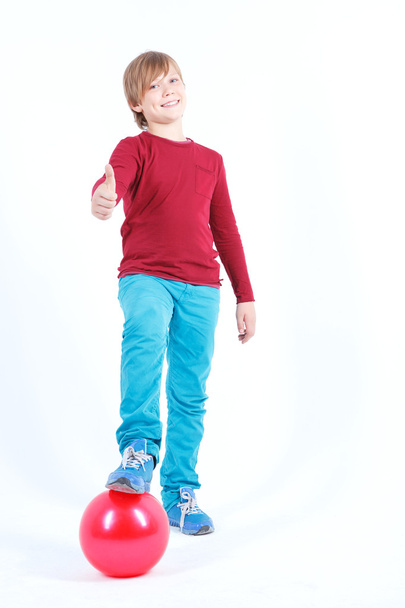 Cheerful boy holding the ball  - Fotó, kép